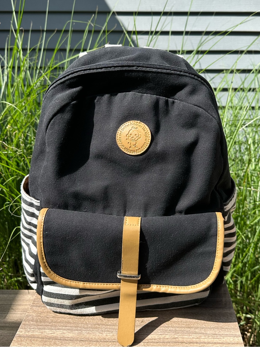 Black Canvas Backpack with Tan Trim and Stripe Sides